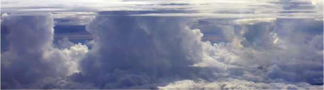 A high elevation view of tall cumulonimbus clouds.