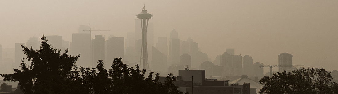 The Space Needle and Seattle skyline obscured by wildfire smoke.